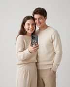 Couple holding the Poche Duo case showing their photo on the e-ink screen