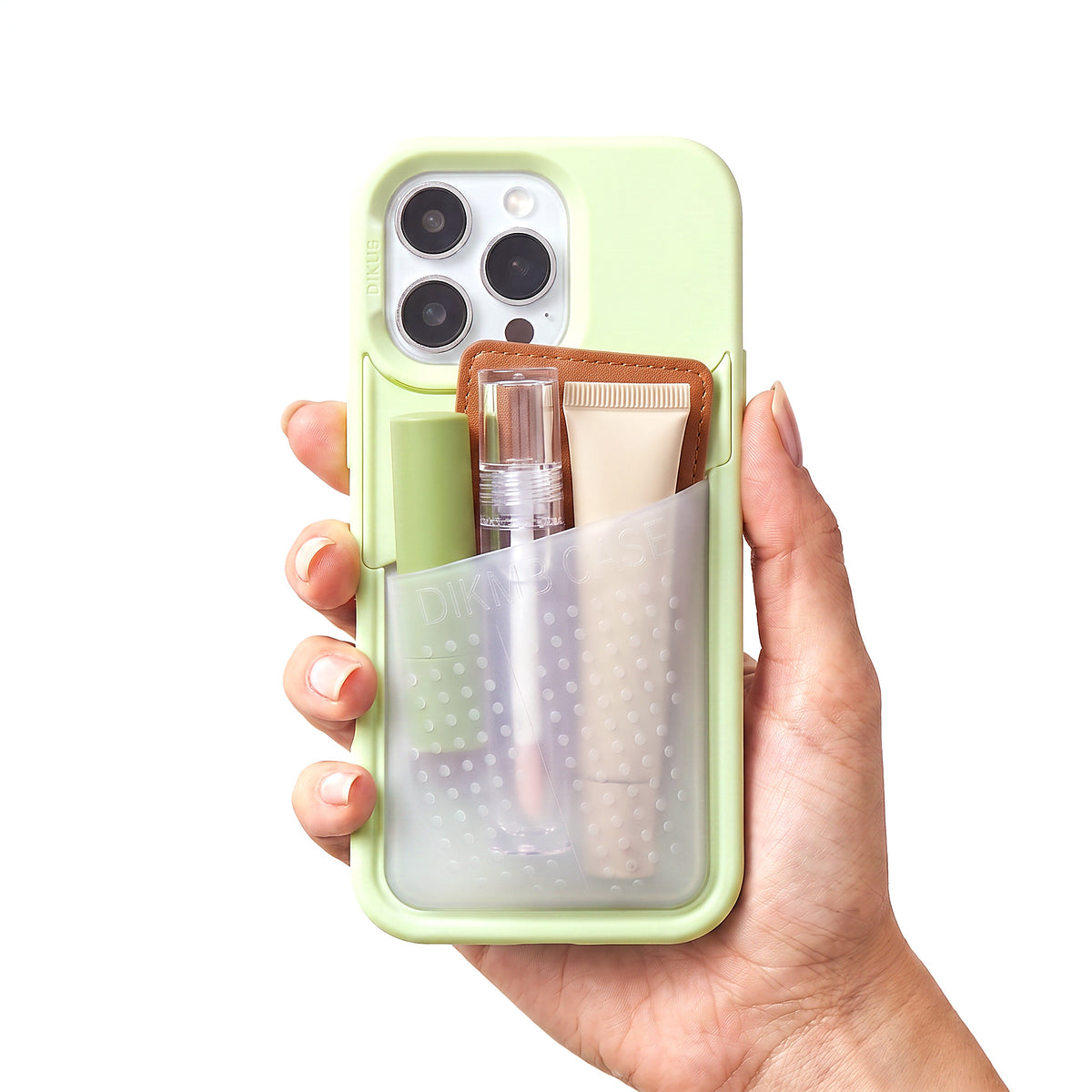 Poche pocket case in pistachio green held in one hand
